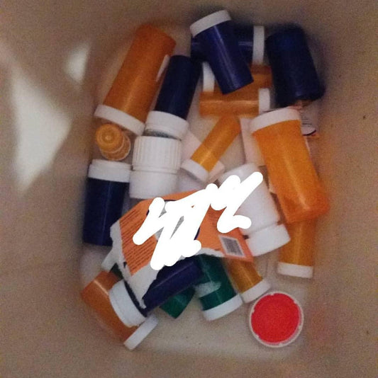 Empty medicine bottles from a senior pet's hospice care journey